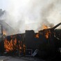 Thousands of firefighters battle California wildfires as more people forced from their homes
