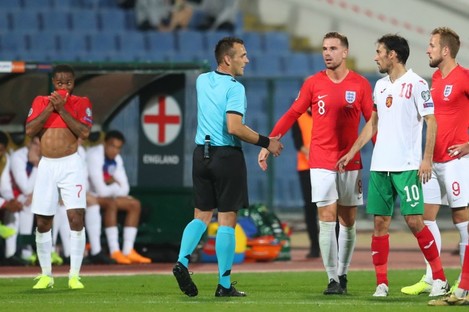 The referee halts play between Bulgaria and England.