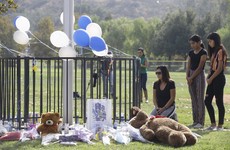 Teenager who killed two students in US school shooting dies as police still hunt for motive