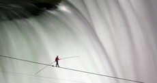 In pictures: Daredevil successfully walks tightrope across Niagara Falls