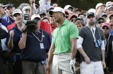 VIDEO: Tiger Woods collides with a cameraman