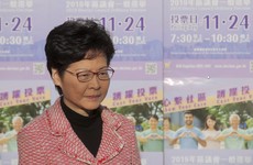Hong Kong leader to 'listen humbly' after pro-democracy parties crush opposition at local elections