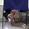 Early exit polls in Greece show top two parties in tie