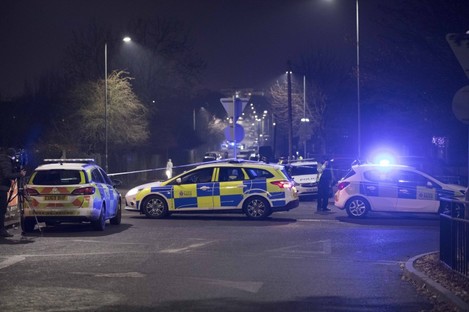 Police at the scene in Essex last night. 