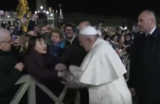Pope Francis apologises after slapping hand of woman who grabbed him