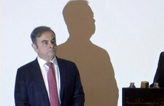 Former Nissan boss makes first public appearance since fleeing Japan
