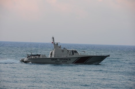 A Turkish coast guard boat searches for the warplane which was shot down by Syria on Friday.