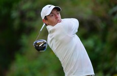 Two eagles puts McIlroy in contention while Woods slips after bright start