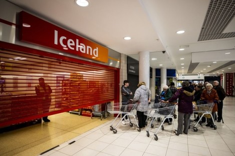 Shoppers waiting at the Iceland store in the Kennedy Centre, Belfast, to open early for a dedicated shopping session for older people 