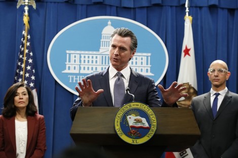 California Governor Gavin Newsom speaks to reporters about the state's response to the coronavirus during a news conference in Sacramento