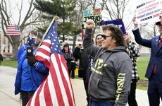 Hundreds protest over Michigan governor’s social distancing order