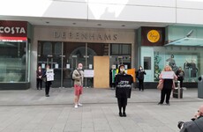 Protesters staging demonstration outside Debenhams store in Dublin are moved on by gardaí