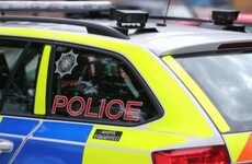 Man (21) arrested after woman's body discovered at flat in Belfast