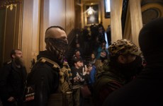 Armed protesters enter Michigan parliament building to demand end to lockdown