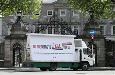 Peta holds billboard protest outside Leinster House calling for closure of meat plants