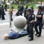 New York police officers suspended after 75 year-old shoved to ground and left in serious condition at protest
