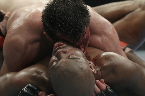 Chael Sonnen, top, competes against Anderson Silva in 2010.