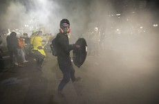 Protesters clash with federal agents outside Portland courthouse as tear gas dispensed