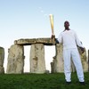 Games legend lights up Stonehenge with Olympic torch visit