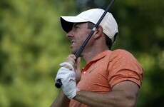 McIlroy battles to make the cut as DJ blazes into two-shot lead
