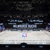 NBA postpone playoff games as players stage boycott in protest at police shooting