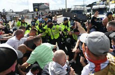 'England til I die': Nine arrested as police clash with anti-migrant protesters in Dover