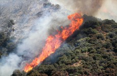 Remote towns evacuated as California battles wildfires and heatwave