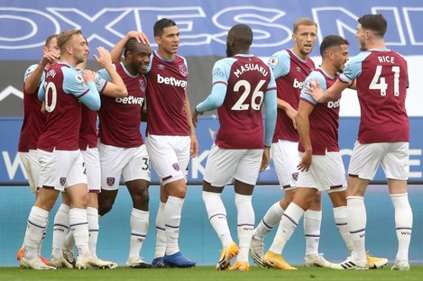 Michail Antonio celebrates with his West Ham team-mates after opening the scoring.