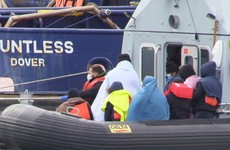 Migrant boats cross the Channel as hundreds greet asylum seekers at barracks