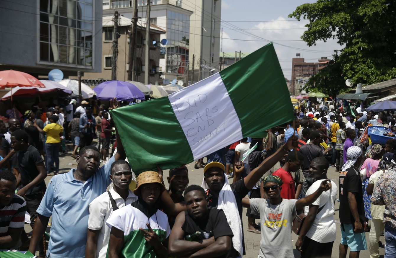 Nigeria security forces fire on protesters as curfew imposed amid ...