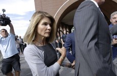 Actress Lori Loughlin reports to prison in college scam