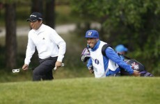Carlos Tevez caddies for Andres Romero at the Open