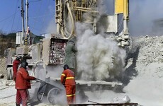 Rescuers say at least two more weeks to free trapped Chinese miners