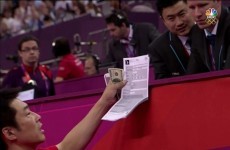 Wait a minute: Why was that Japanese coach handing a wad of $100 bills to a gymnastics judge?