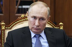 Putin signs law allowing him to serve two more terms