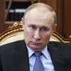 Putin signs law allowing him to serve two more terms