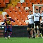 Messi nets a double at Valencia to rescue Barcelona's title hopes