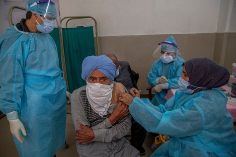 A Kashmiri man receives a vaccine for Covid-19