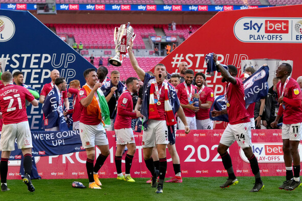 Irish midfielder earns controversial penalty in extra-time as Morecambe promoted to League One - Vimarsana News