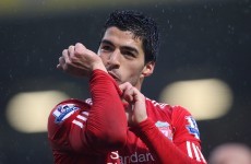 Suarez agrees new Liverpool deal