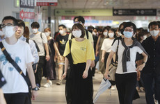 Japan to expand virus emergency one week into Olympics
