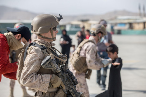 A US marine provides security during evacuation flights at Hamid Karzai International Airport at the weekend. 