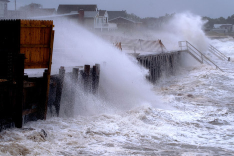 Waves pound a seawall in Montauk, New York as Tropical Storm Henri affects the Atlantic coast.