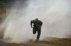 Polish forces use water cannons on migrants at Belarus border