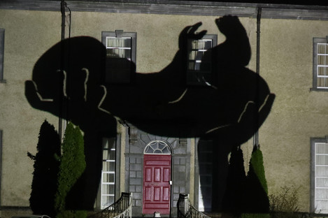 An image of a newborn baby is projected onto Sean Ross Abbey in County Tipperary on St Brigid's Day for the Herstory Light Show.