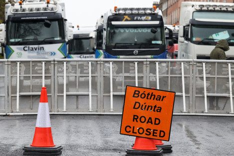 Trucks behind a road closed sign on Merrion Street South in Dublin today.