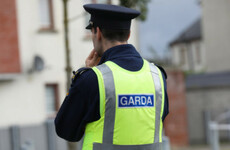 A man has been arrested in connection with shots fired at garda car in July