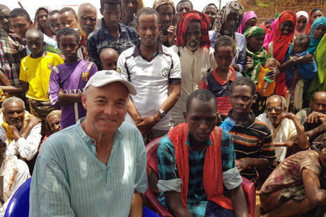 Healy visits with displaced families in Somalia.