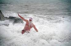 Photos: hardy souls brave the rain and cold and take to the sea for Christmas day swims