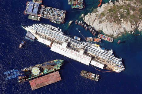 The Costa Concordia as it lies on its side next to Giglio Island in Italy. August 2013.